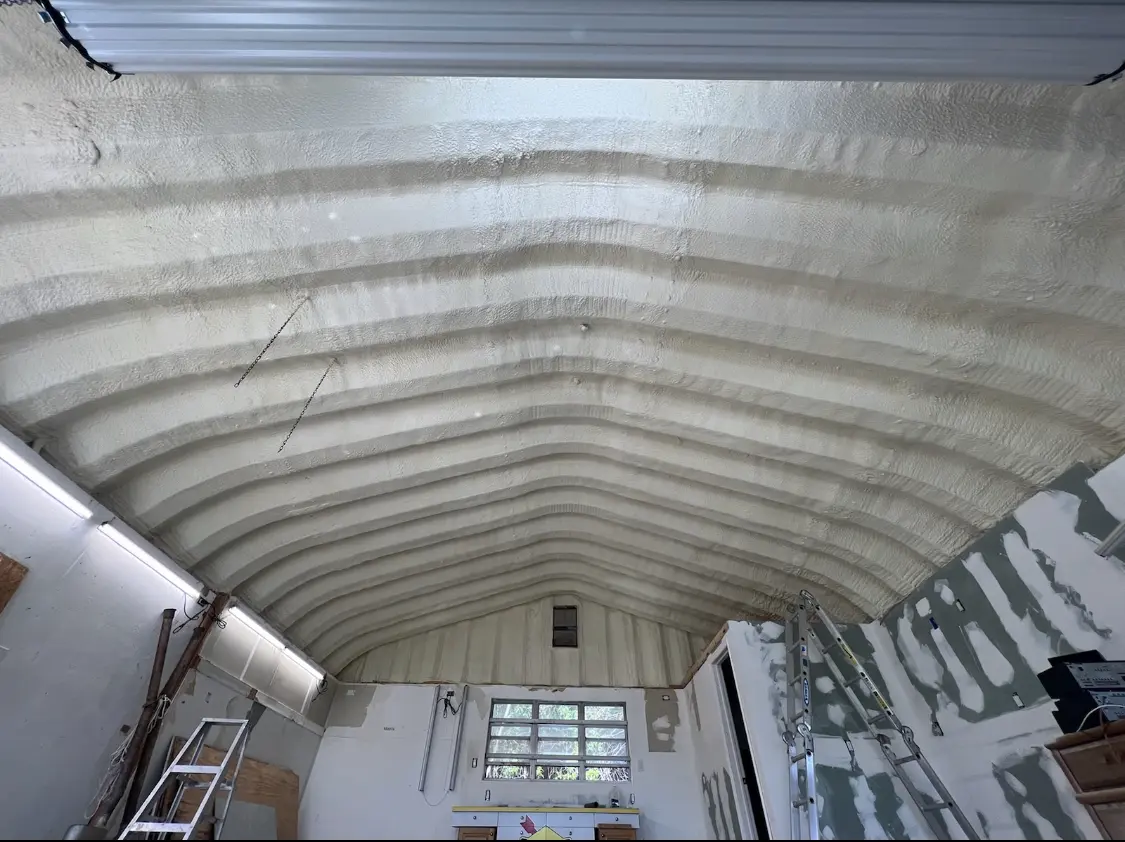 Spray polyurethane foam applied to the underside of a metal roof deck in Benton Park